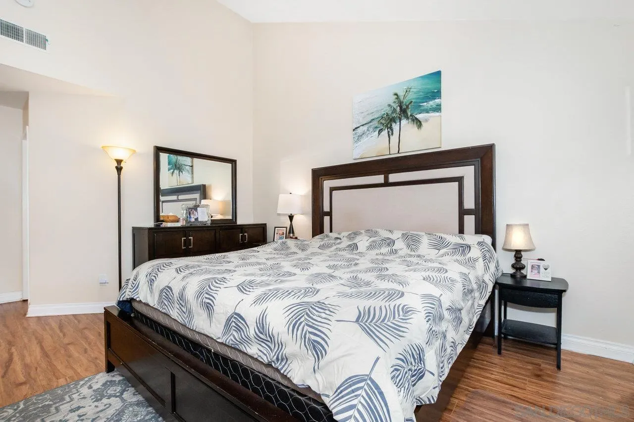 1458 Summit Drive Chula Vista, CA 91910 - Photo 11 of 22 a bedroom with a bed and a potted plant