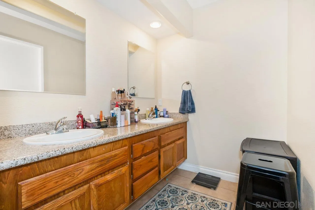 1458 Summit Drive Chula Vista, CA 91910 - Photo 12 of 22 a bathroom with a sink and a mirror