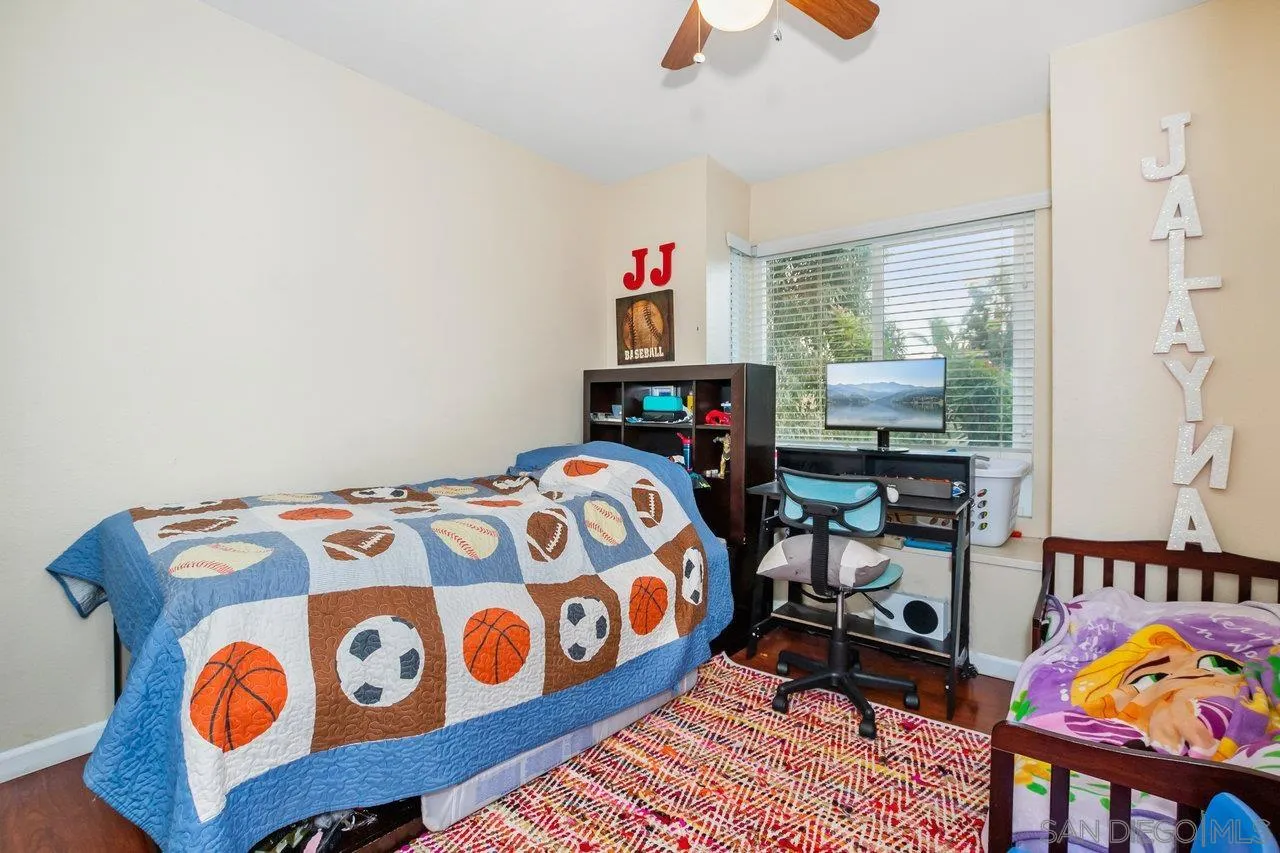 1458 Summit Drive Chula Vista, CA 91910 - Photo 15 of 22 a bedroom with a bed a window and dresser