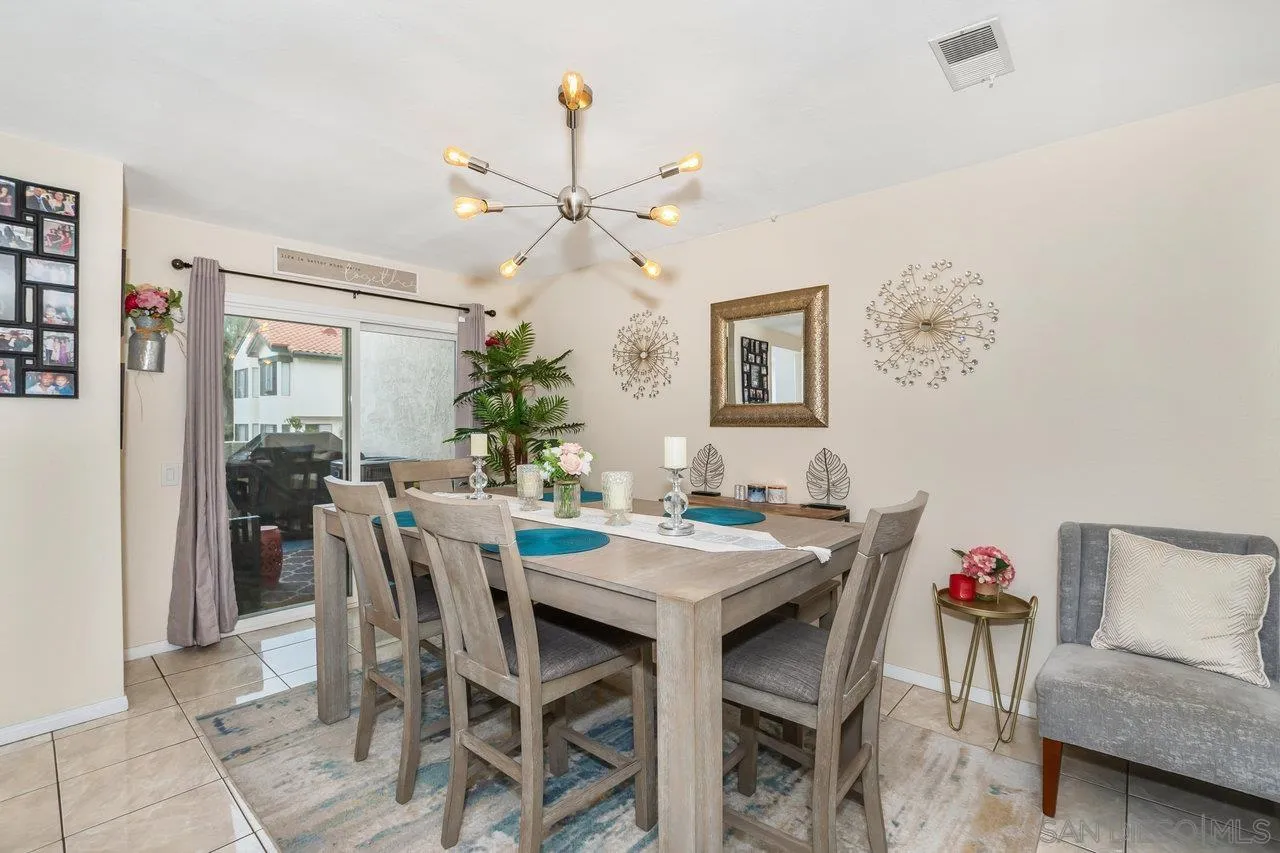 1458 Summit Drive Chula Vista, CA 91910 - Photo 2 of 22 a view of a dining room with furniture and a chandelier