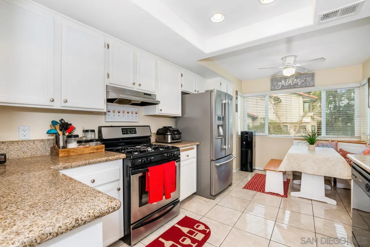 1458 Summit Drive Chula Vista, CA 91910 - Photo 8 of 22 a kitchen with stainless steel appliances granite countertop a refrigerator stove and sink