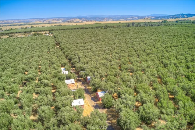 a view of a brick house with many windows