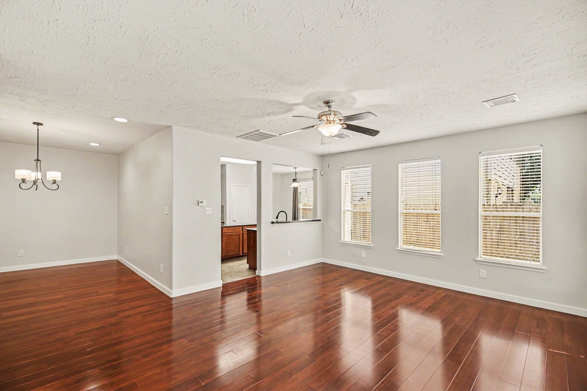 7419 Hollister Ridge Houston, TX 77040 - Photo 4 of 27 Spacious living room is open to dining and kitchen.