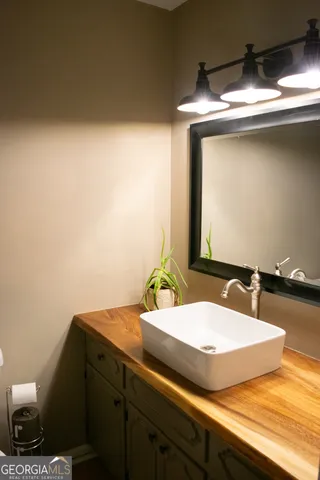 a white toilet sitting next to a small bathroom