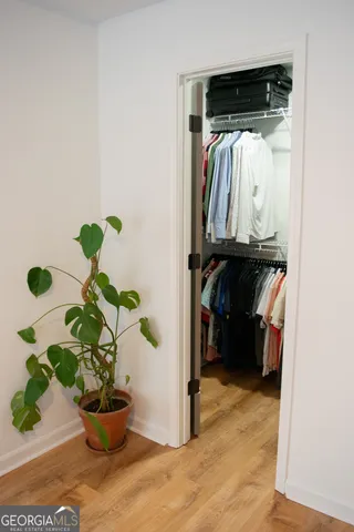 a spacious bathroom with a double vanity sink and mirror