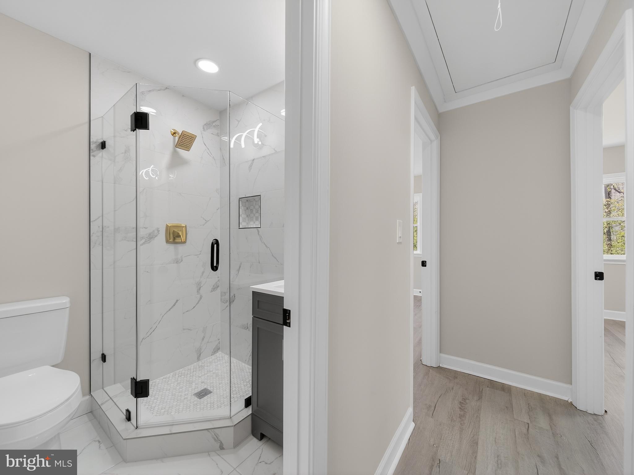 4475 Virginia Avenue Prince Frederick, MD 20678 - Photo 18 of 51 a bathroom with a glass shower door