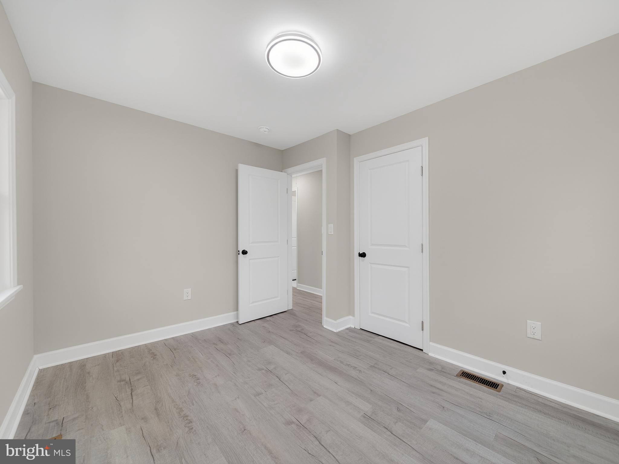 4475 Virginia Avenue Prince Frederick, MD 20678 - Photo 28 of 51 a view of an empty room with wooden floor