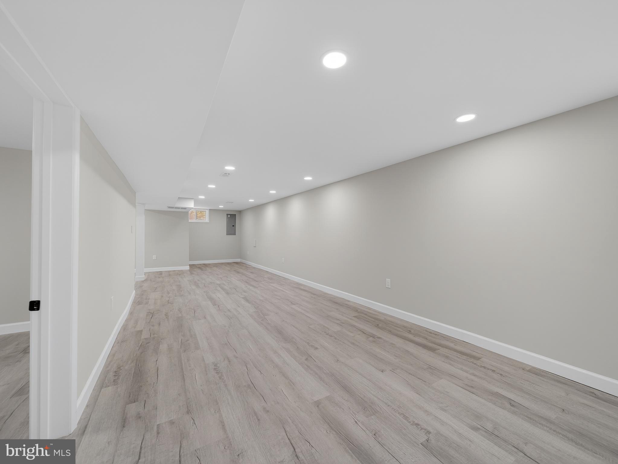 4475 Virginia Avenue Prince Frederick, MD 20678 - Photo 35 of 51 wooden floor in an empty room with a window