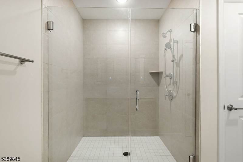 70 Ridgedale Avenue, Unit 310 Morristown, NJ 07960 - Photo 11 of 21 a bathroom with a shower and a sink