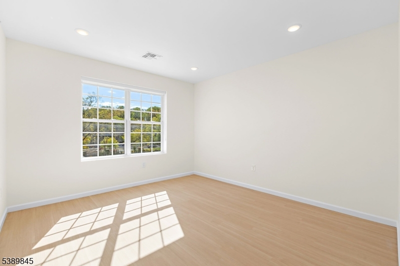 70 Ridgedale Avenue, Unit 310 Morristown, NJ 07960 - Photo 13 of 21 an empty room with windows