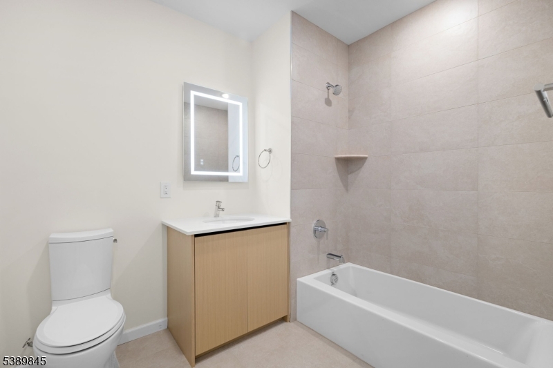 70 Ridgedale Avenue, Unit 310 Morristown, NJ 07960 - Photo 16 of 21 a bathroom with a toilet a sink and bathtub