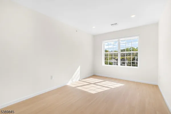 a view of a big room with windows
