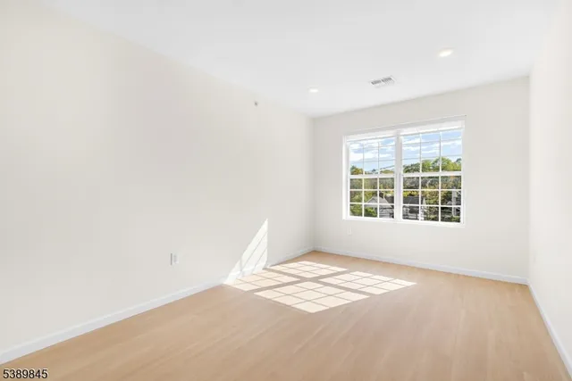 a view of a big room with windows