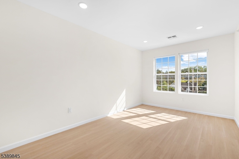 70 Ridgedale Avenue, Unit 310 Morristown, NJ 07960 - Photo 8 of 21 an empty room with a window