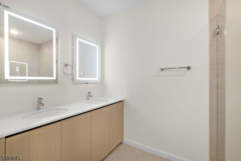 70 Ridgedale Avenue, Unit 310 Morristown, NJ 07960 - Photo 10 of 21 a bathroom with a sink and a mirror
