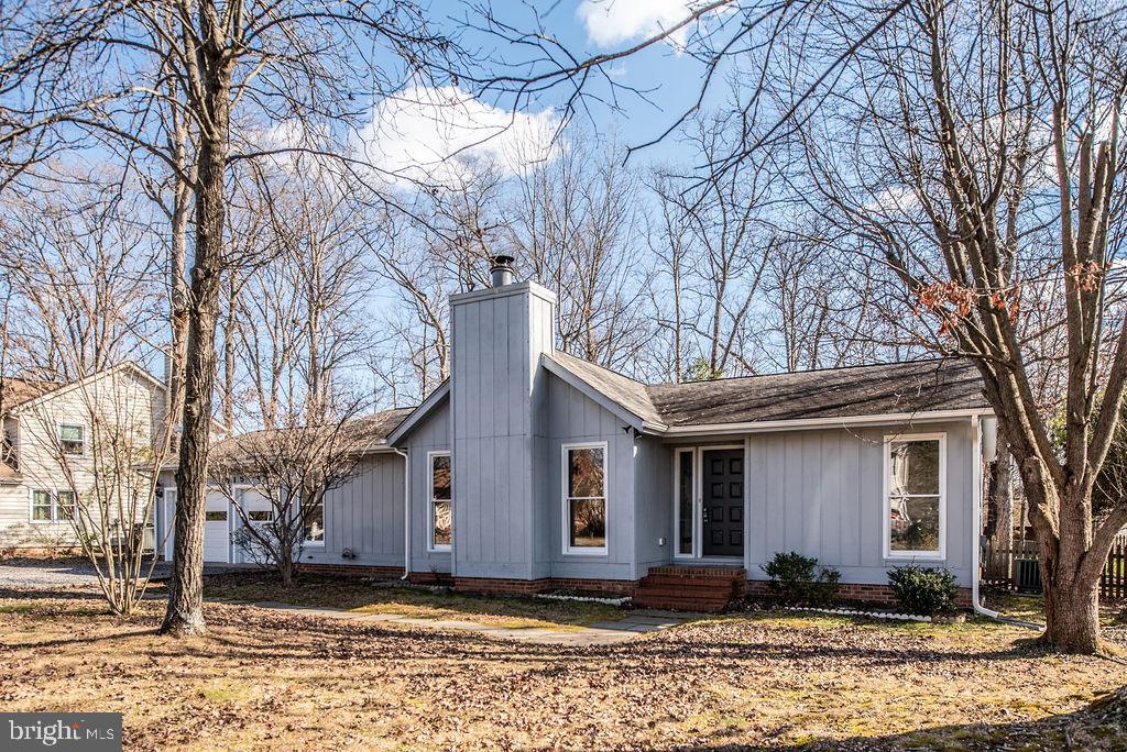 3915 Doran Road Fredericksburg, VA 22407 - Photo 2 of 57 a front view of a house with a yard