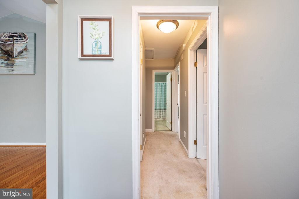 3915 Doran Road Fredericksburg, VA 22407 - Photo 28 of 57 a view of a hallway with wooden floor and a bathroom