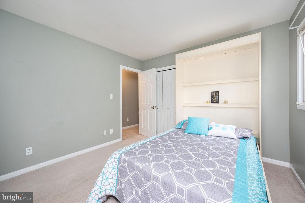 3915 Doran Road Fredericksburg, VA 22407 - Photo 35 of 57 a bedroom with a large bed and a painting on the wall