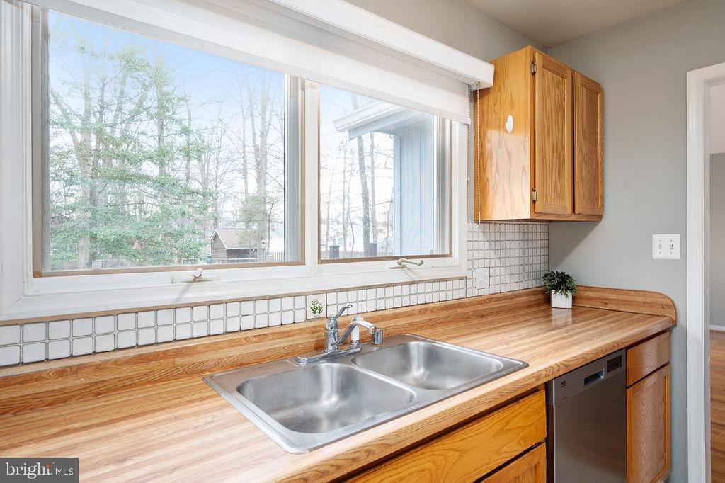 3915 Doran Road Fredericksburg, VA 22407 - Photo 50 of 57 a view of a kitchen sink a faucet and chandelier