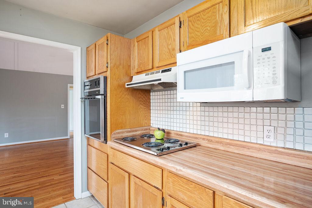 3915 Doran Road Fredericksburg, VA 22407 - Photo 51 of 57 a kitchen with a stove and a wooden floor