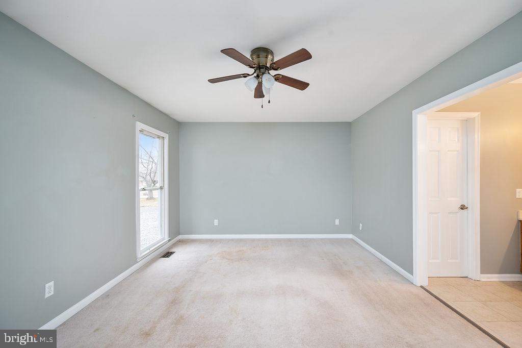 3915 Doran Road Fredericksburg, VA 22407 - Photo 52 of 57 a view of a livingroom with a ceiling fan and window