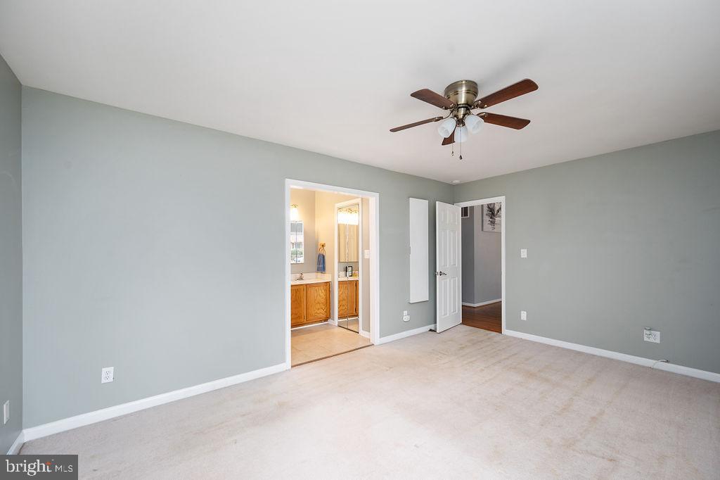 3915 Doran Road Fredericksburg, VA 22407 - Photo 53 of 57 a view of a livingroom with a ceiling fan & windows