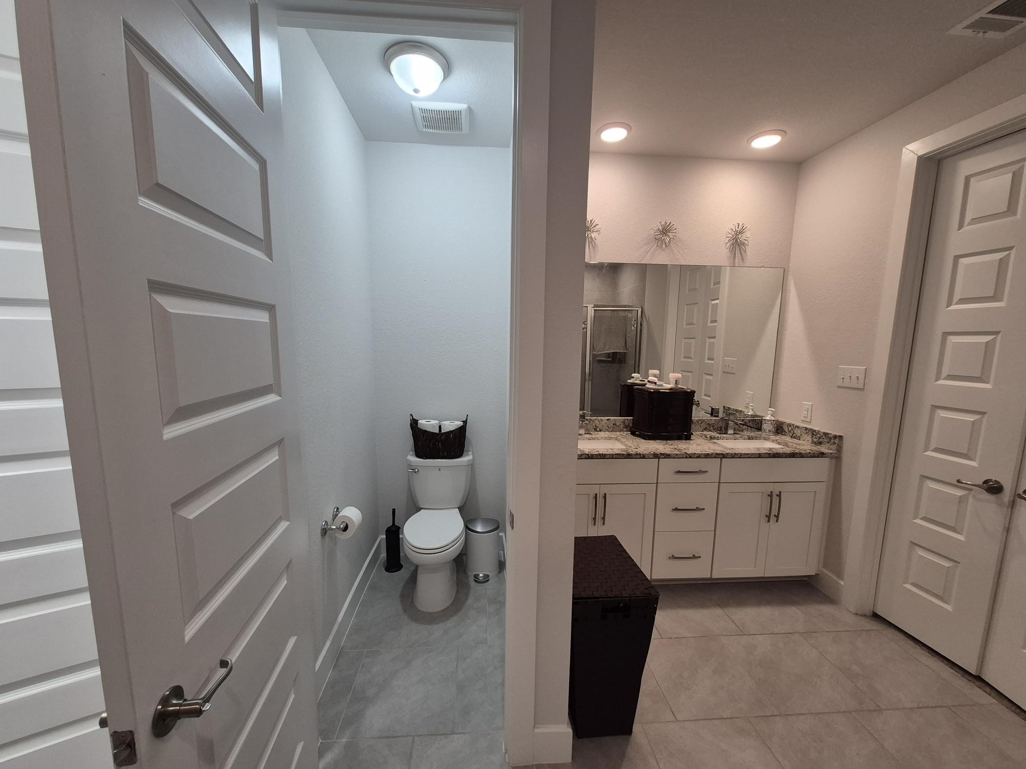 15814 Weston Ridge Drive Humble, TX 77346 - Photo 11 of 43 a bathroom with a sink a toilet and a mirror