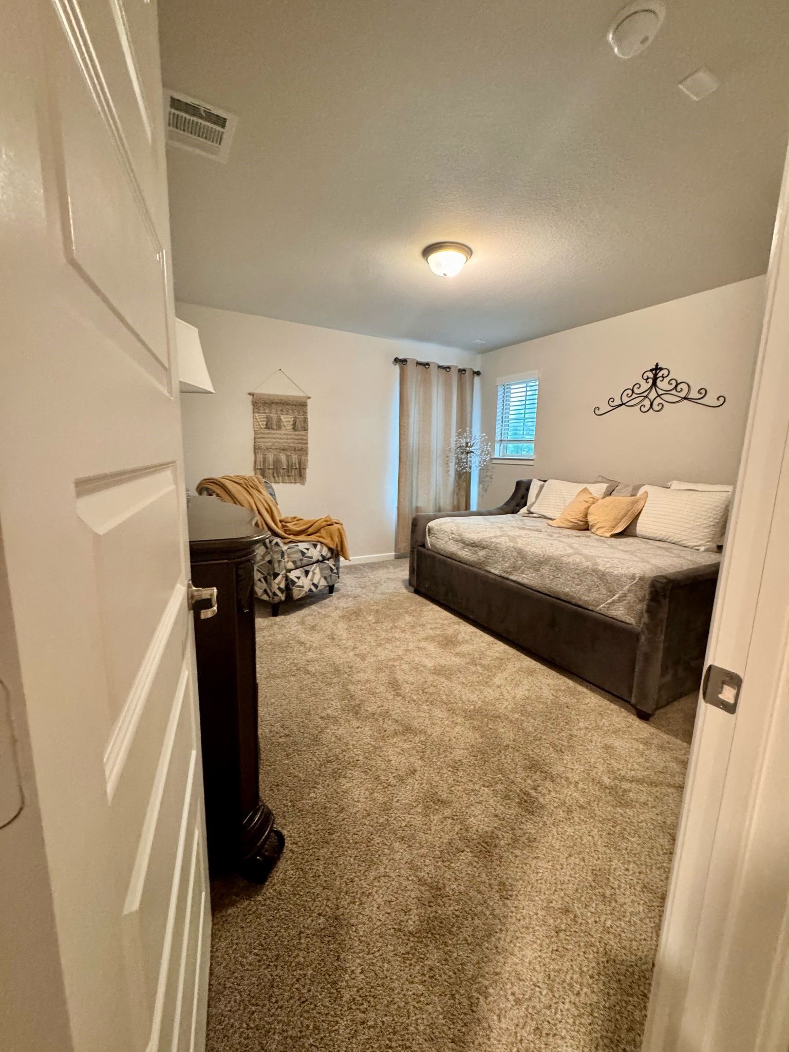 15814 Weston Ridge Drive Humble, TX 77346 - Photo 16 of 43 a bedroom with a bed and a window
