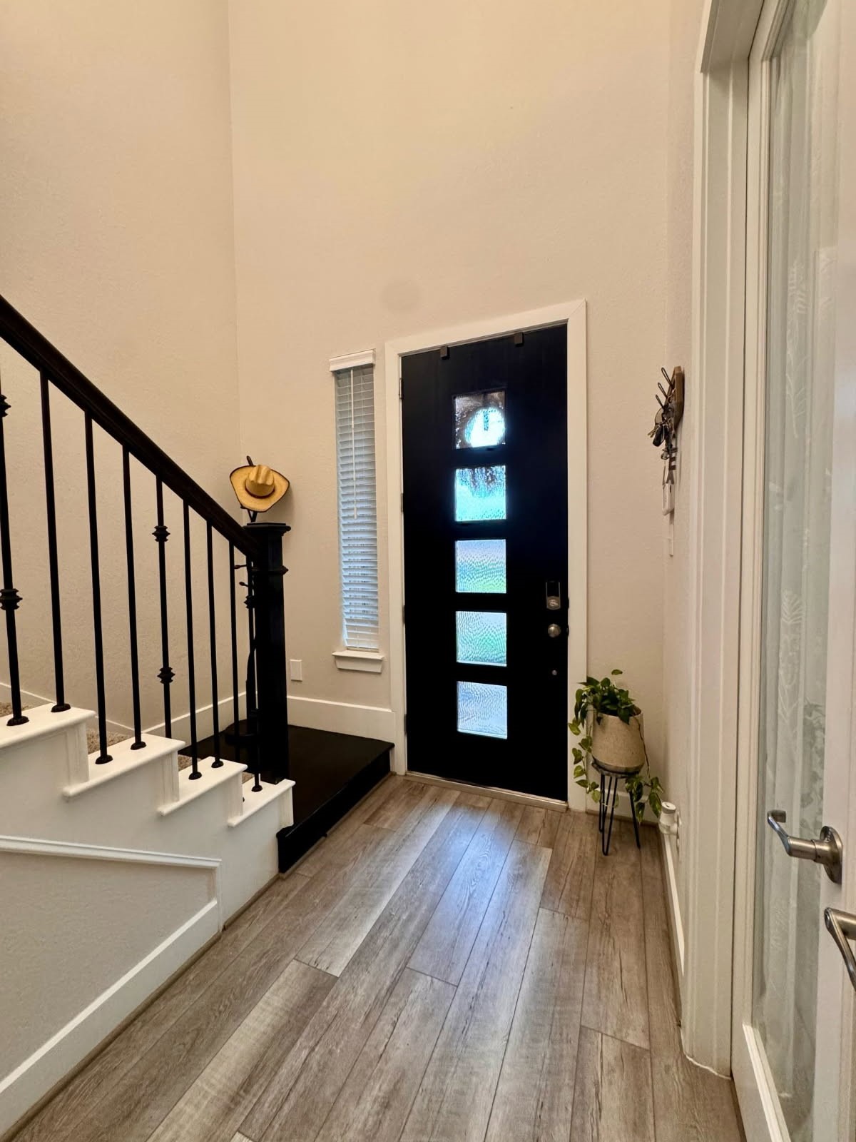 a view of a room with wooden floor and stairs
