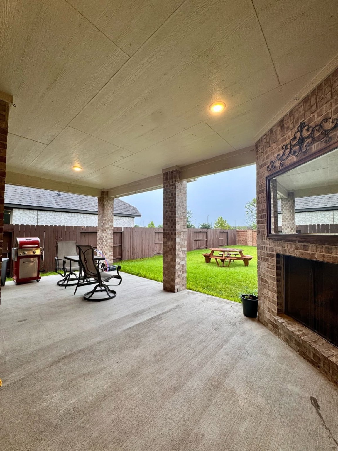 15814 Weston Ridge Drive Humble, TX 77346 - Photo 23 of 43 a view of a patio with a table and chairs under an umbrella