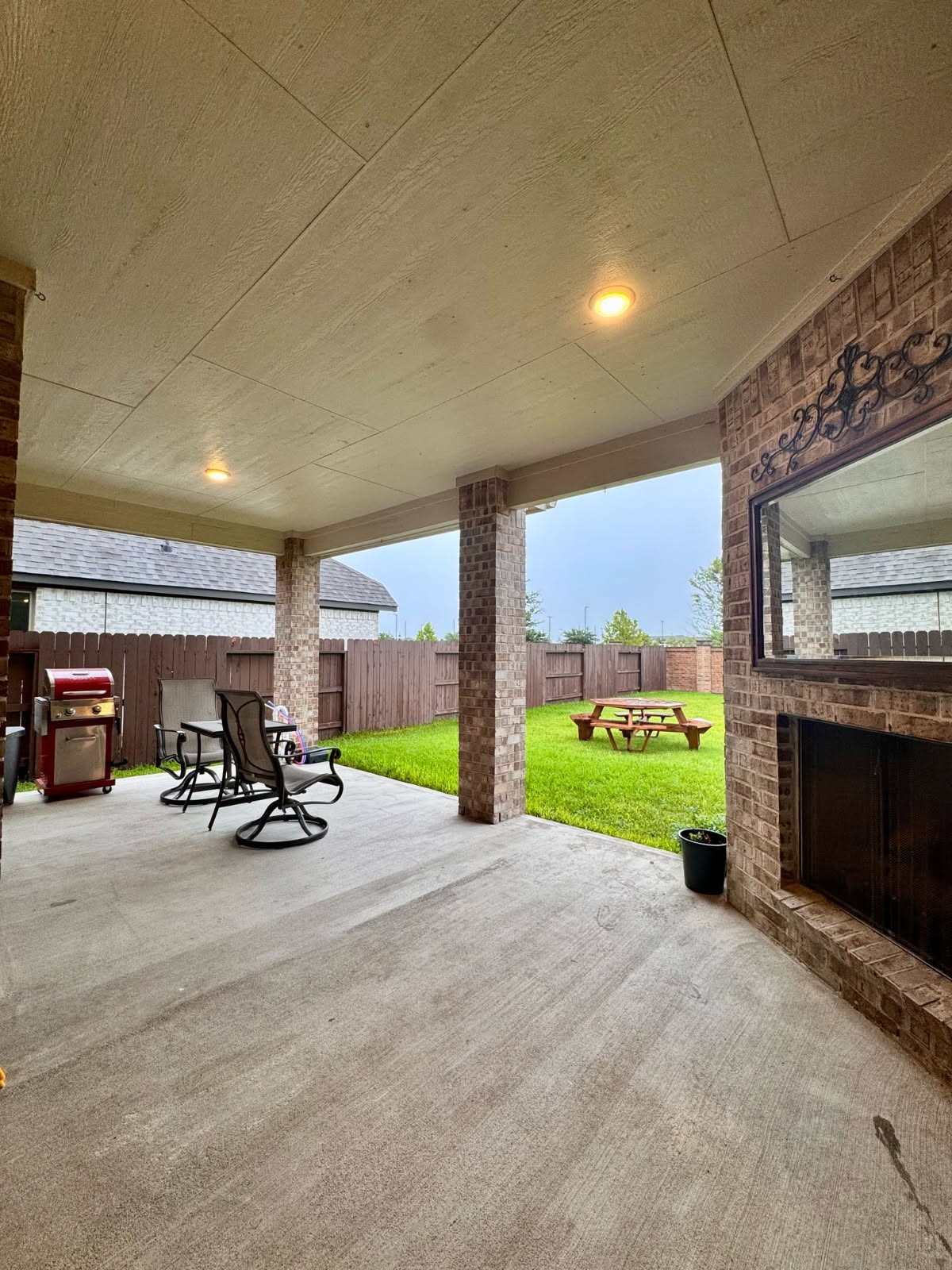 15814 Weston Ridge Drive Humble, TX 77346 - Photo 22 of 43 a view of a patio with a table and chairs under an umbrella