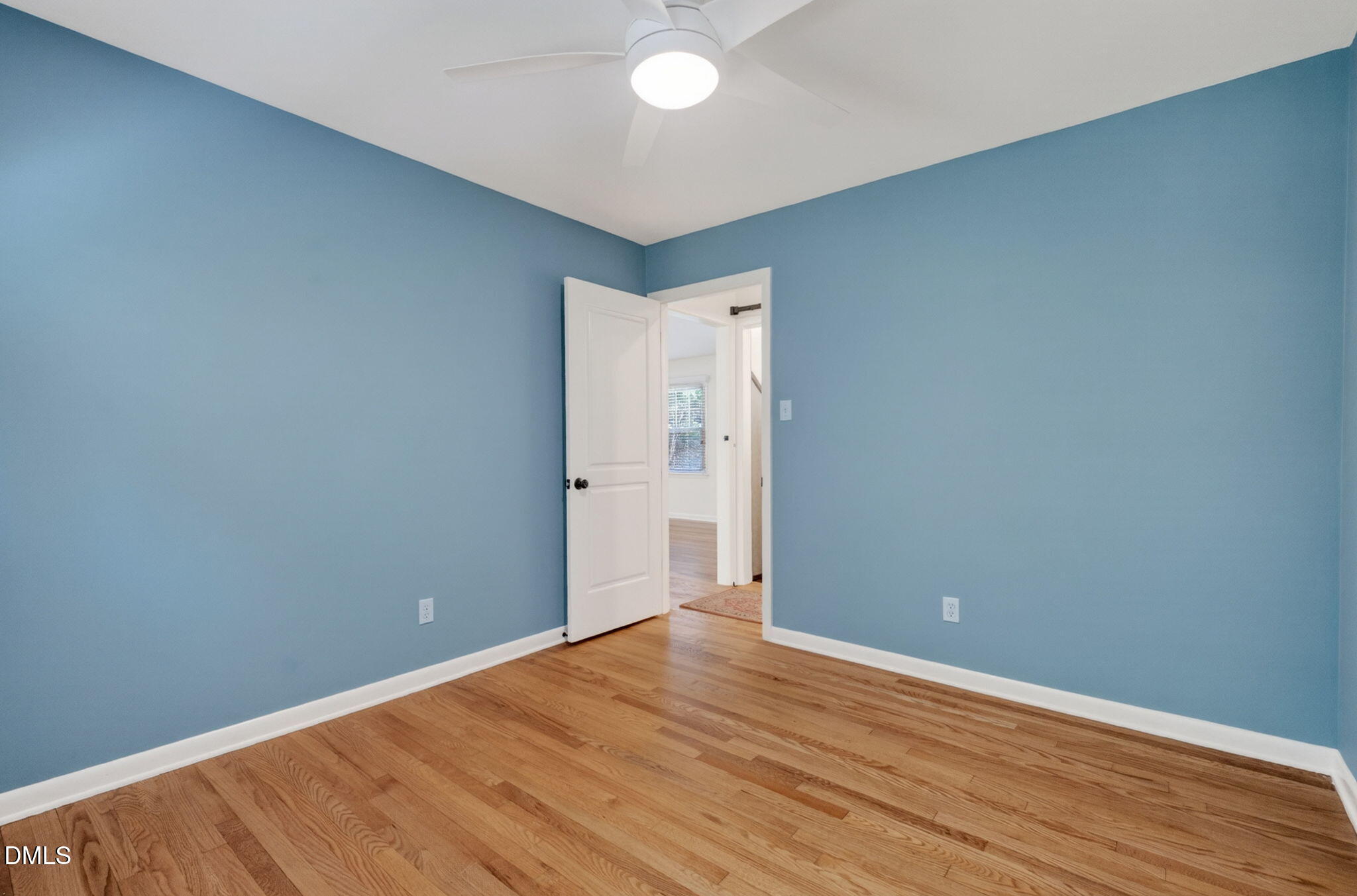 1224 Pineview Drive Raleigh, NC 27606 - Photo 17 of 45 an empty room with wooden floor and windows