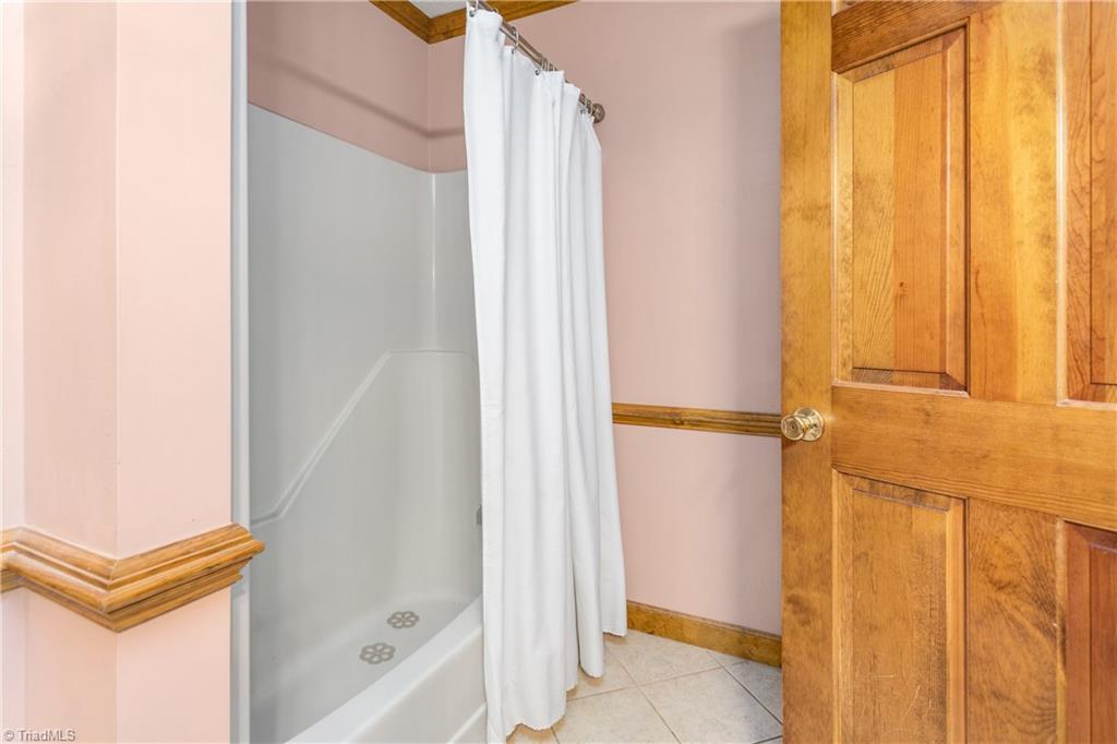7763 Alcorn Road Oak Ridge, NC 27310 - Photo 24 of 32 Primary Bedroom Bath