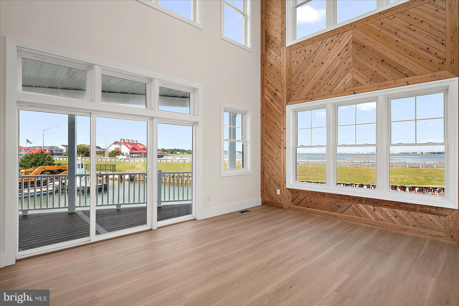 12971 Inlet Isle Lane Ocean City, MD 21842 - Photo 23 of 134 Family Room with glass sliding door