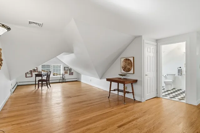 a view of a livingroom with furniture and wooden floor