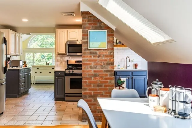 a living room with furniture fireplace and flat screen tv