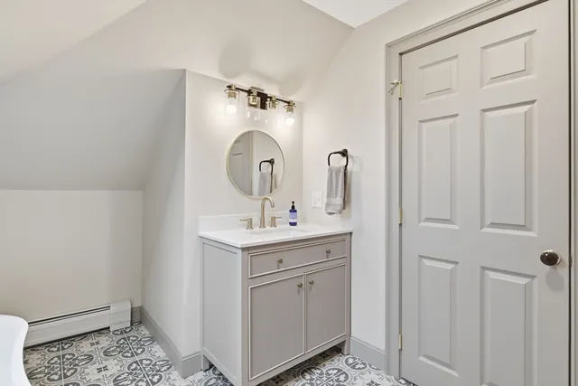 a bathroom with a sink a toilet and vanity
