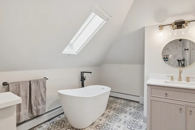 a bathroom with a bathtub and a sink