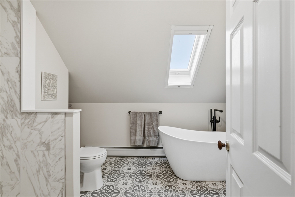 30 Graves Avenue, Unit B Northampton, MA 01060 - Photo 30 of 41 a bathroom with a toilet a sink and bathtub