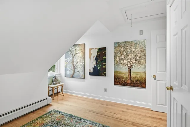 a view of an entryway with wooden floor