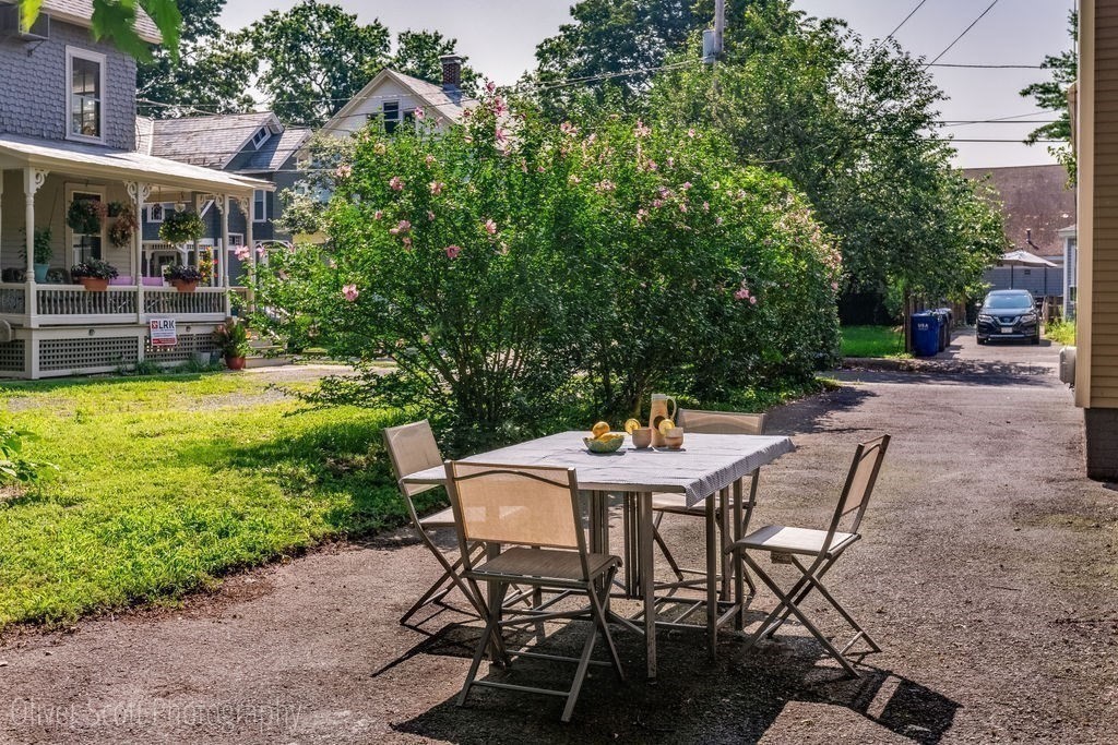 30 Graves Avenue, Unit B Northampton, MA 01060 - Photo 40 of 41 a view of a patio with table and chairs and potted plants