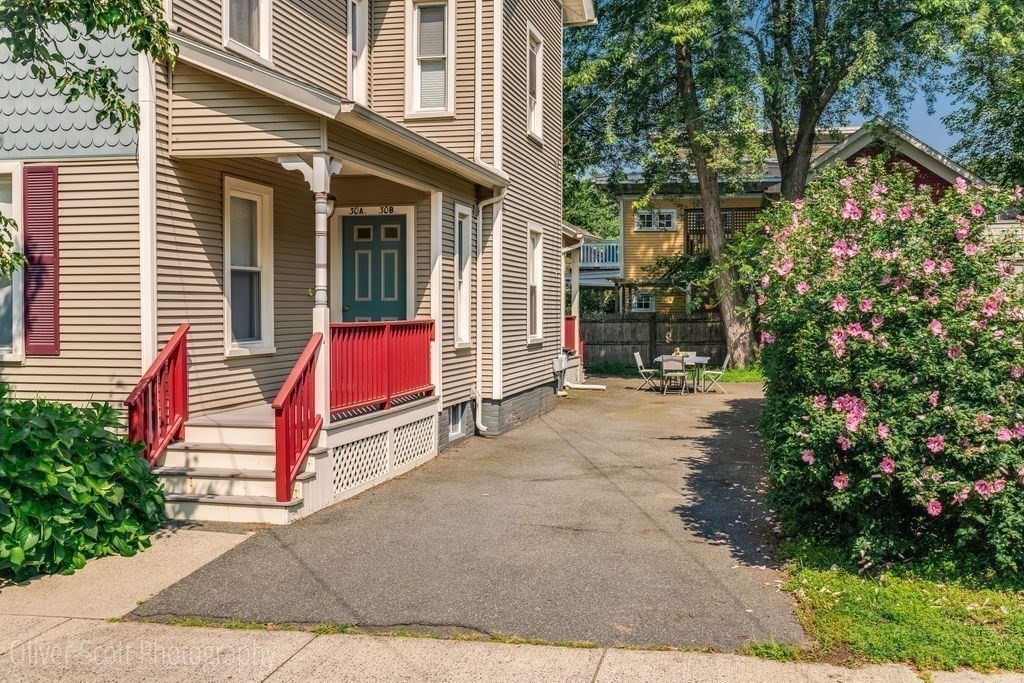 30 Graves Avenue, Unit B Northampton, MA 01060 - Photo 4 of 41 a view of brick building with a bench and potted plants