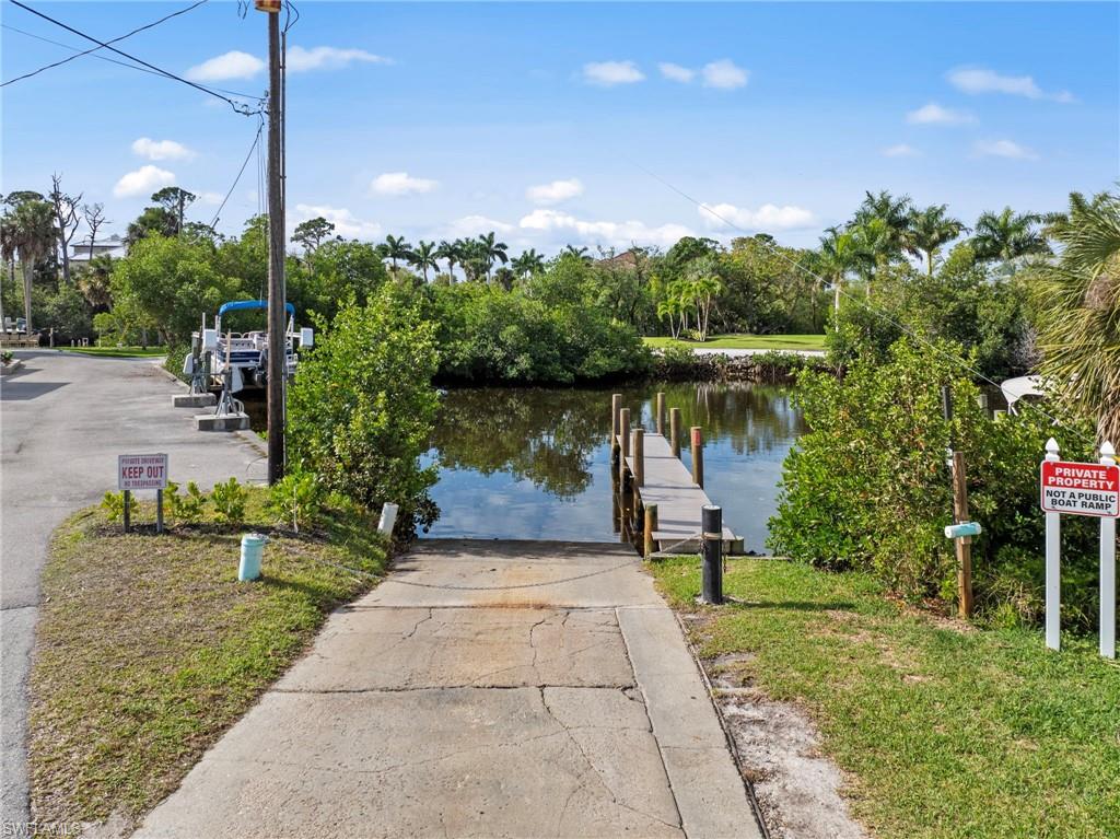 4724 Riverside Drive Estero, FL 33928 - Photo 41 of 44 a lake view with a bench in the background