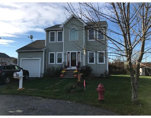35 Wyndham Court Fall River, MA 02721 - Photo 1 of 14 a front view of a house with a garden and yard