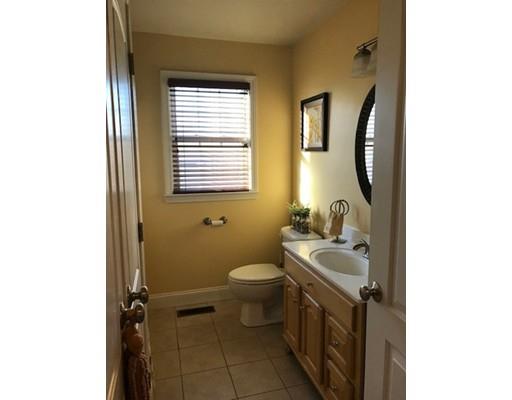 35 Wyndham Court Fall River, MA 02721 - Photo 13 of 14 a bathroom with a granite countertop toilet a sink and a mirror