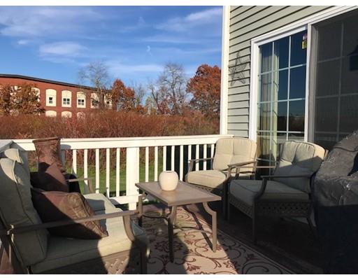 35 Wyndham Court Fall River, MA 02721 - Photo 5 of 14 a balcony with wooden floor and outdoor seating