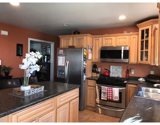 35 Wyndham Court Fall River, MA 02721 - Photo 10 of 14 a kitchen with stainless steel appliances granite countertop a refrigerator and a stove top oven