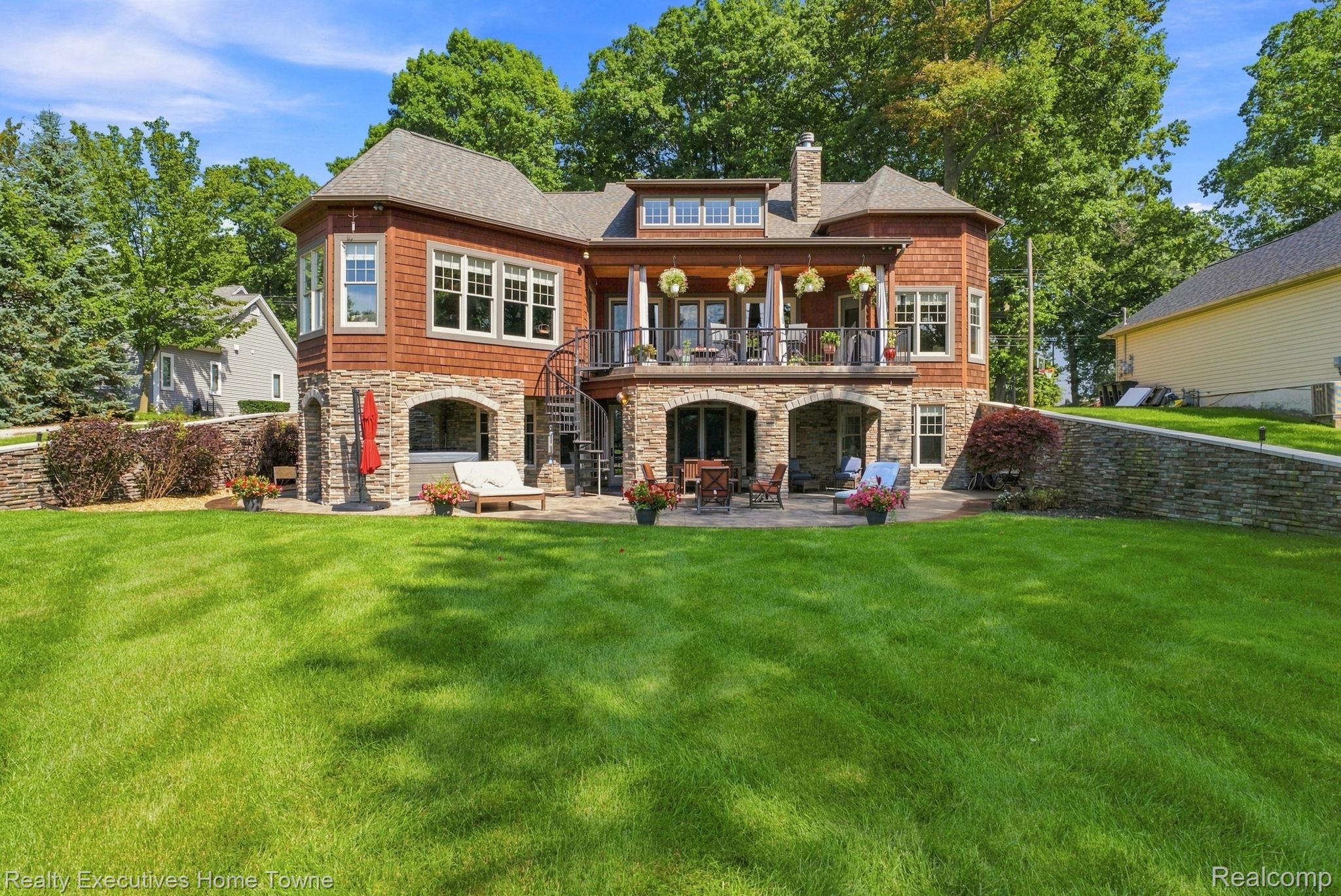 2829 Riverside Drive Port Huron, MI 48060 - Photo 58 of 99 Stone and shake exterior with a multi-level deck and patio