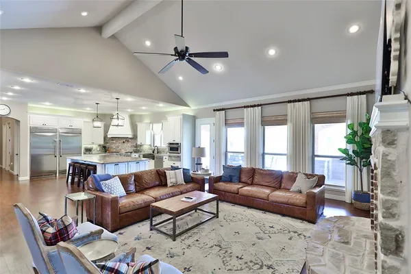 a view of a kitchen with cabinets and wooden floor