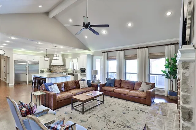 a view of a kitchen with cabinets and wooden floor